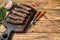 Homamade grilled Lula kebab meat sausages on a cutting board. wooden background. Top view. Copy space