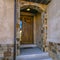 Home with arched entryway and brown door in Utah