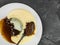 Home Baked Sticky Toffee Pudding Dessert Served With Hot Custard