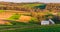 Home and barn on the farm fields and rolling hills of Southern York County, PA