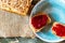 Home breakfast. A quick breakfast. Coffee and sandwich. Jam sandwich. Self-made bread. Raspberry jam .
