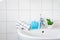 Home care image bathroom washbaisn ,tab water with a bottle blue gel alcohol sanitizers for washing hand and hand towel for