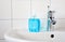 Home care image bathroom washbaisn ,tab water with a bottle blue gel alcohol sanitizers for washing hand for protect family from