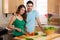 Home chefs lovely couple prepare a happy healthy nutrition based low calorie meal
