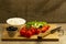 Home cooking summer Greek salad on wooden background