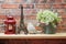 Home decoration with Red lantern, eiffel tower, bird statue and artificial plant on wooden shelve