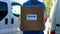 Home delivery service courier in uniform holding cardboard box, express shipping