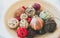 Home details decorations lying on the shelf. Wooden background. Loft style. Cosy rustic mood. Straw and rattan balls in vase