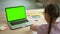 Home education for children girl pupil writes near laptop Spbd