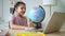 Home education of junior schoolchildren girl turns globe Spbd