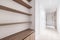 A home entrance foyer and hallway with wooden cabinets