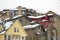 Home exteriors with horizontal wall siding and thick snow on the roofs