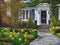 home with front yards with spring flowers