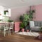 Home garden, dining and living room in white and red tones. Island with chairs, parquet and mani houseplants. Urban jungle