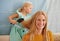 Home, hair brush and mom with girl for smile in bonding to play for child development or growth. Portrait, parent and