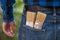 Home handyman: Rear view of a young man with paint brushes in his pocket