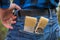 Home handyman: Rear view of a young man with paint brushes in his pocket