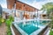 Home or house building Exterior and interior design showing tropical pool villa with green garden