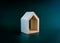 Home, house, family, real estate, property concepts. White minimal miniature wooden small house.