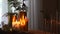 Home hygge with golgen candles and pine trees. Christmas time. Lifestyle cozy home
