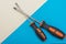 Home improvement: two screwdrivers philips and slotted on a blue and white flat lay background with copy space