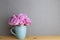 Home interior. Bunch of purple rose flowers on wooden table