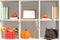 Home interior decor for Halloween. White shelves black cat photo frames books pumpkins