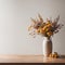 Home interior with wooden table with vase, bouquet of dried flowers near blank wall. Home interior background design with blank