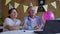 Home isolation, joyful grandparents with balloons and horns have fun celebrating a birthday online chatting with friends