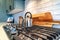 Home kitchen interior with kettle over the burner of a cooktop with five knobs