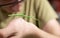 Home life scenes: A boy plays while holding his stick insect