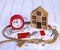 Home loan concept. Wooden house, rope knot, red alarm clock, house keys, dollar bills, credit cardsGenerated image