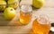 Home made apple jelly jars on rustic wooden table