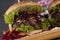 Home made burgers on wooden background