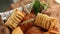 Home made cookies and buns in bread basket on a brown background. Lifestyle