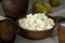 Home-made cottage cheese in earthenware, clay cup of milk, pears