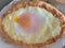 Home made diet proper nutrition khachapuri - traditional Georgian pie with cheese and egg. Horizontal image