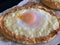 Home made diet proper nutrition khachapuri - traditional Georgian pie with cheese and egg. Horizontal image