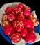 Home made dyed eggs, colorful red eggs prepared for Easter with various patterns, traditional Orthodox painted eggs ready for