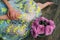 Home made floral decoration on a dark background. Beautiful chrysanthemum in a vase. Purple chrysanthemum, pink flowers on a shelf