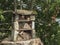 Home made insect hotel decorative bug house from sandstone and wood, ladybird and bee home for butterfly hibernation and
