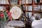 Home-made library with antique chairs and red roses in a vase