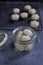 Home made of Malaysia traditional Coconut Cream Cookies or & x27;Kuih Bangkit& x27; on the table over dark background.