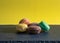 Home made still life with yellow plain background and coloured macaroons