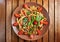 Home made vegan pasta with mushrooms, tomatoes and basil