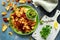 Home made vegetable crisps from carrots, parsnips and beetroot with watercress guacamole