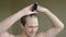 At home, a man shaves his bald spot in front of a mirror. hair loss problem