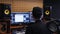 Home music studio. Sound engineer mixing and mastering at sound music studio. Digital audio workstation. Home recording studio.