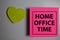 Home Office Time write on a book isolated on Office Desk