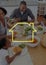 Home outline with family having food on dining table